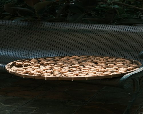 A group of indonesian snake fruits also known as salak on a traditional woven basket